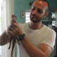 M. Aaron Owen holding a conscious but lightly sedated mongoose in St. Croix.